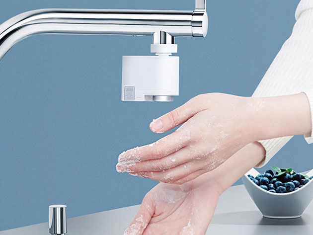 A person washing their hands. 