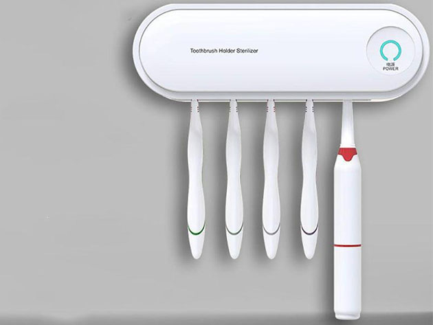 Five toothbrushes connected to a sterilizing device. 