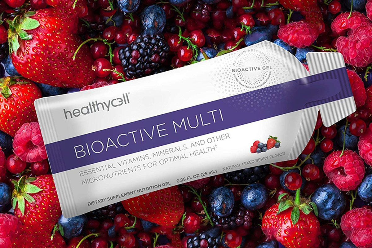 A packet of healthycell Bioactive Multi, with assorted berries in the background